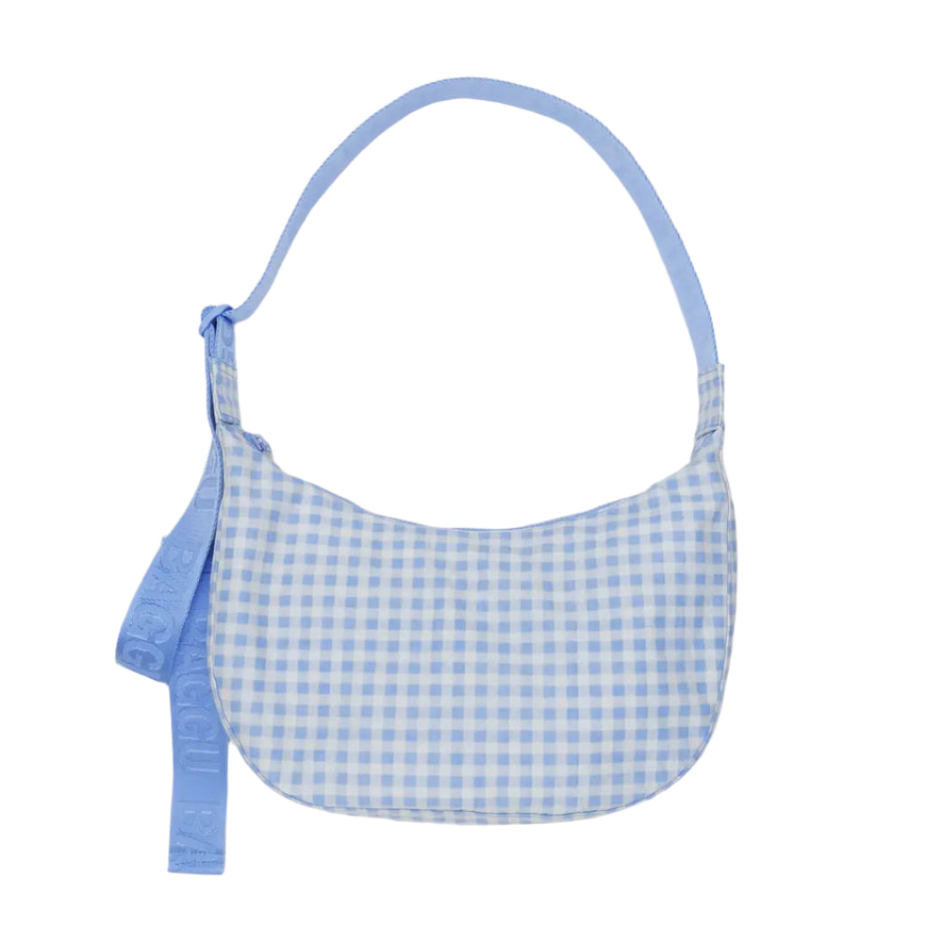 Green and black checkered bag with a strap on a white background