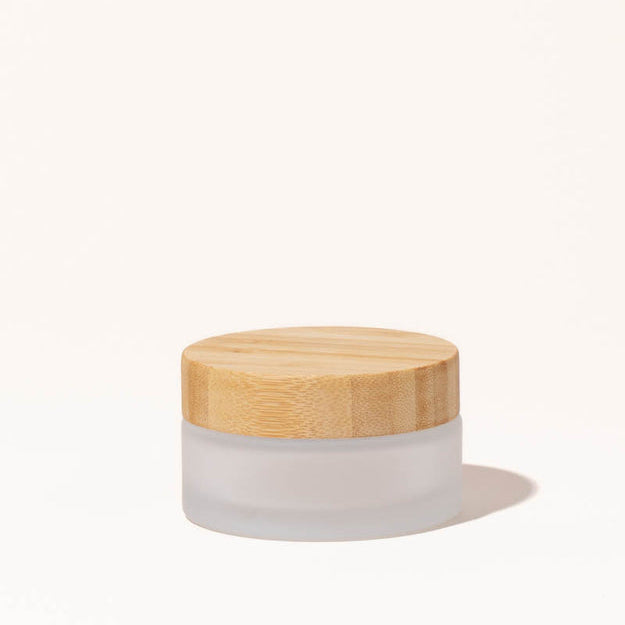 Simply Zero Forever Jar in frosted glass with bamboo lid, large 3.4 oz size, on a cream background