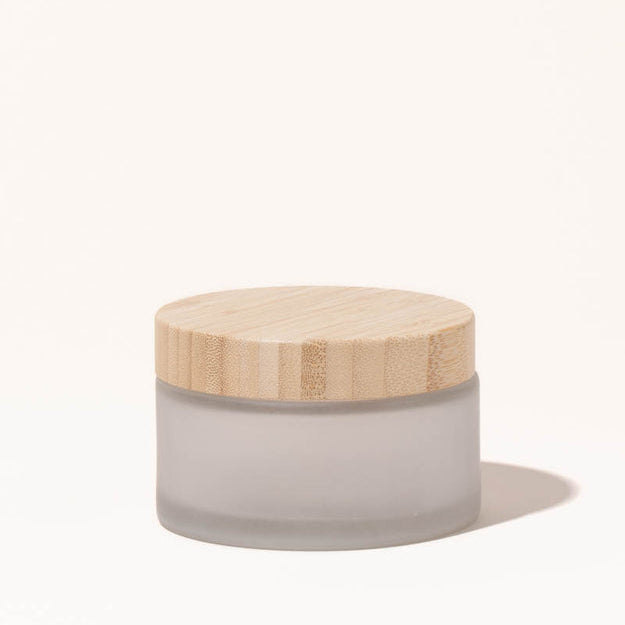 Simply Zero Forever Jar in frosted glass with bamboo lid, large 6.7 oz size, on a cream background