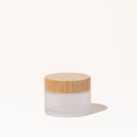 Simply Zero Forever Jar in frosted glass with bamboo lid, large 1.7 oz size, on a cream background