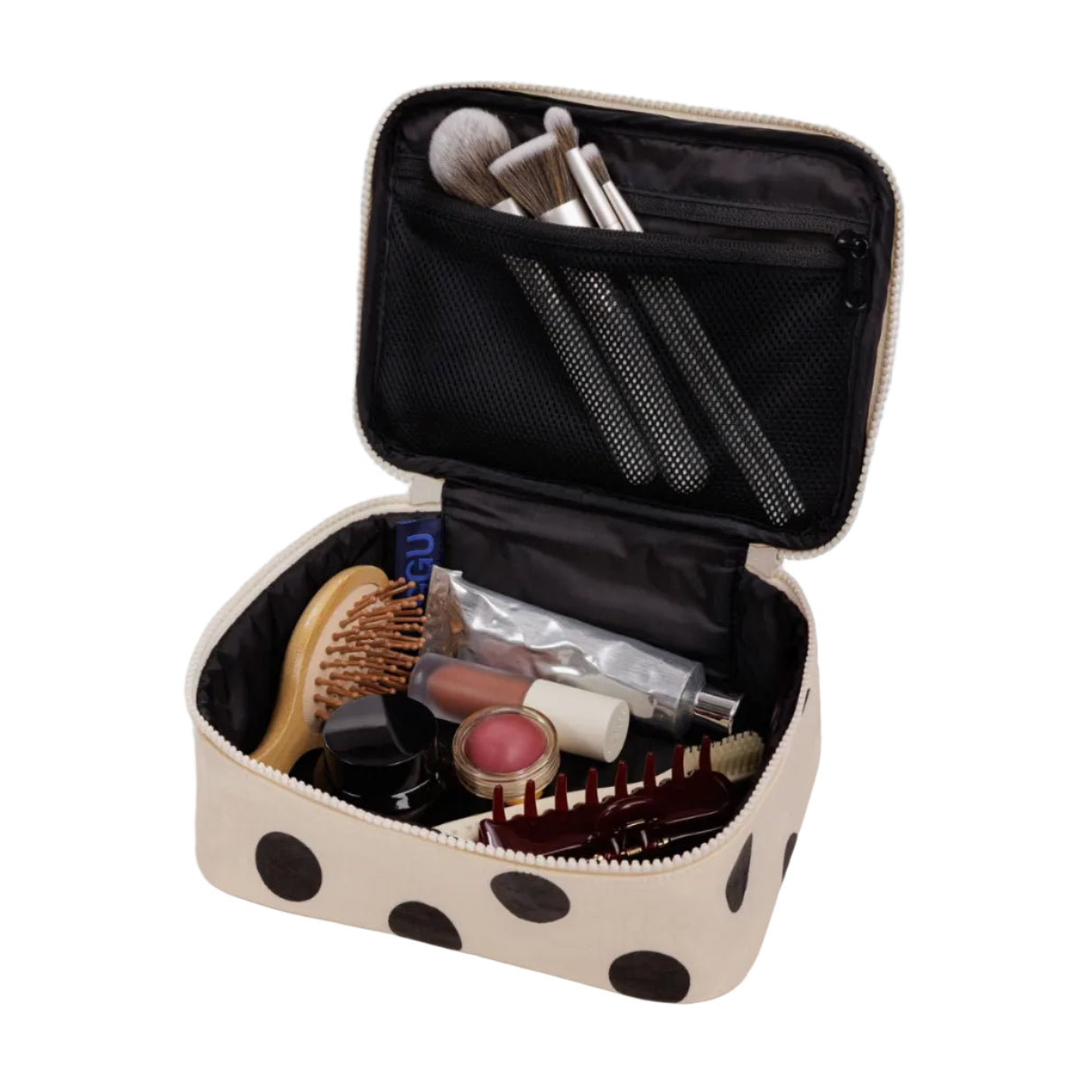 Makeup case with polka dot pattern containing various makeup items on a white background