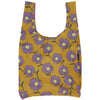Reusable bag with purple floral pattern on mustard yellow background