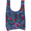 Reusable bag with red apple pattern on a blue background