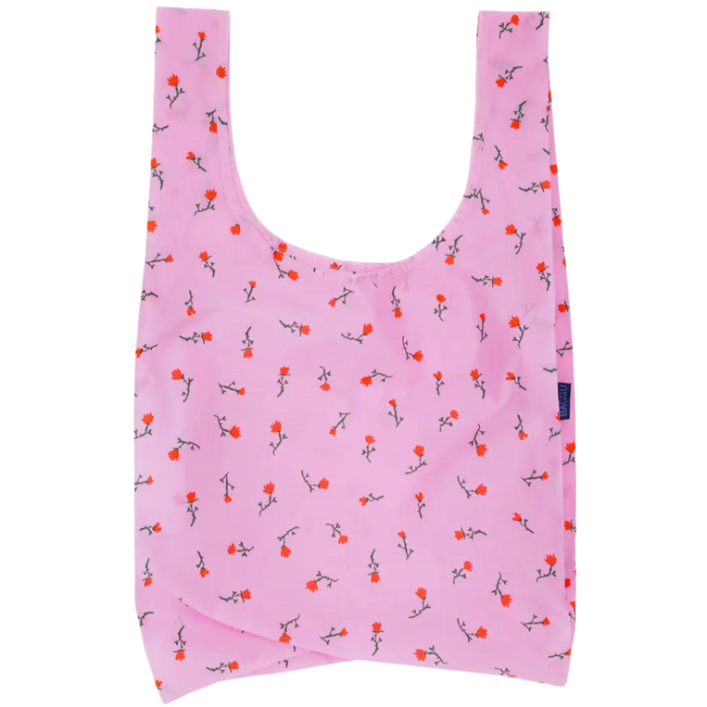 Pink reusable bag with floral pattern on a white background
