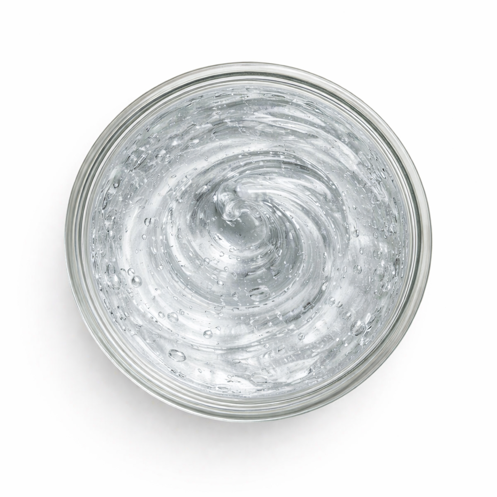 Clear gel in a glass jar on a white background